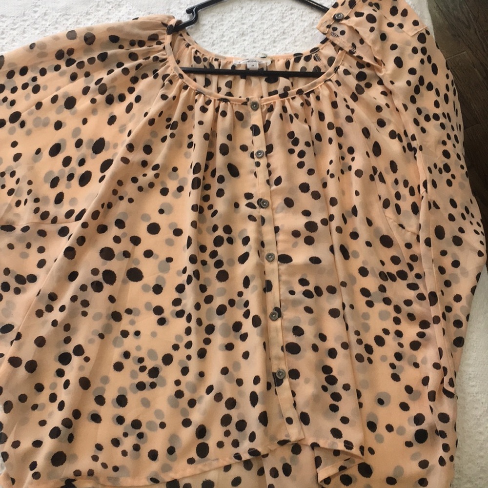 Polka dot flowing button up blouse.